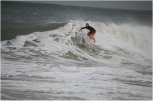 Jason Chancler (Ocean City Local Surfer) jets along the white water…nice. 