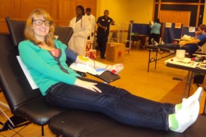 Kristina Kiss '13 leaned back comfortably while giving blood. Kiss claimed that giving blood is more fun when you do it with friends.