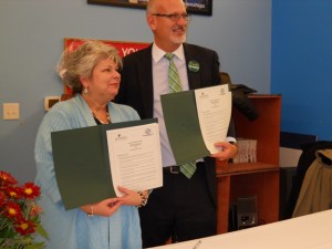 (left to right) Boys and Girls Club Executive Board Member Beth Tevis and McDaniel College President Dr. Roger Casey hold up copies of a signed contract announcing the official establishment of the partnership between McDaniel College and the Boys and Girls Club of Westminster at a special ceremony at the club on November 4th, 2010. 