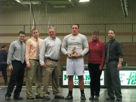 Brock Glotfelty accepts his award and smiles for a picture after setting his career record.